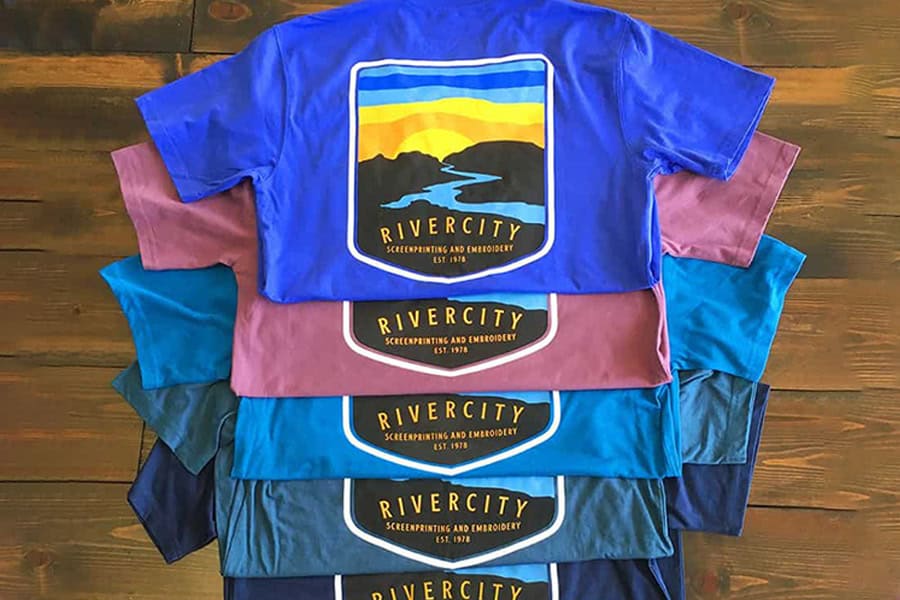 Rivercity's New Braunfels promotional products shirts displayed in multiple colors.
